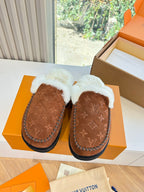 Pair of brown monogram suede shearling slippers with white fleece trim