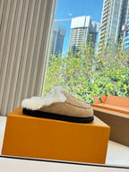 Louis Vuitton shearling moccasin slipper on box, tan suede with white fur top