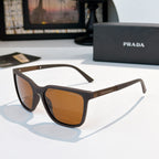 Prada sunglasses with dark frames and amber-tinted lenses