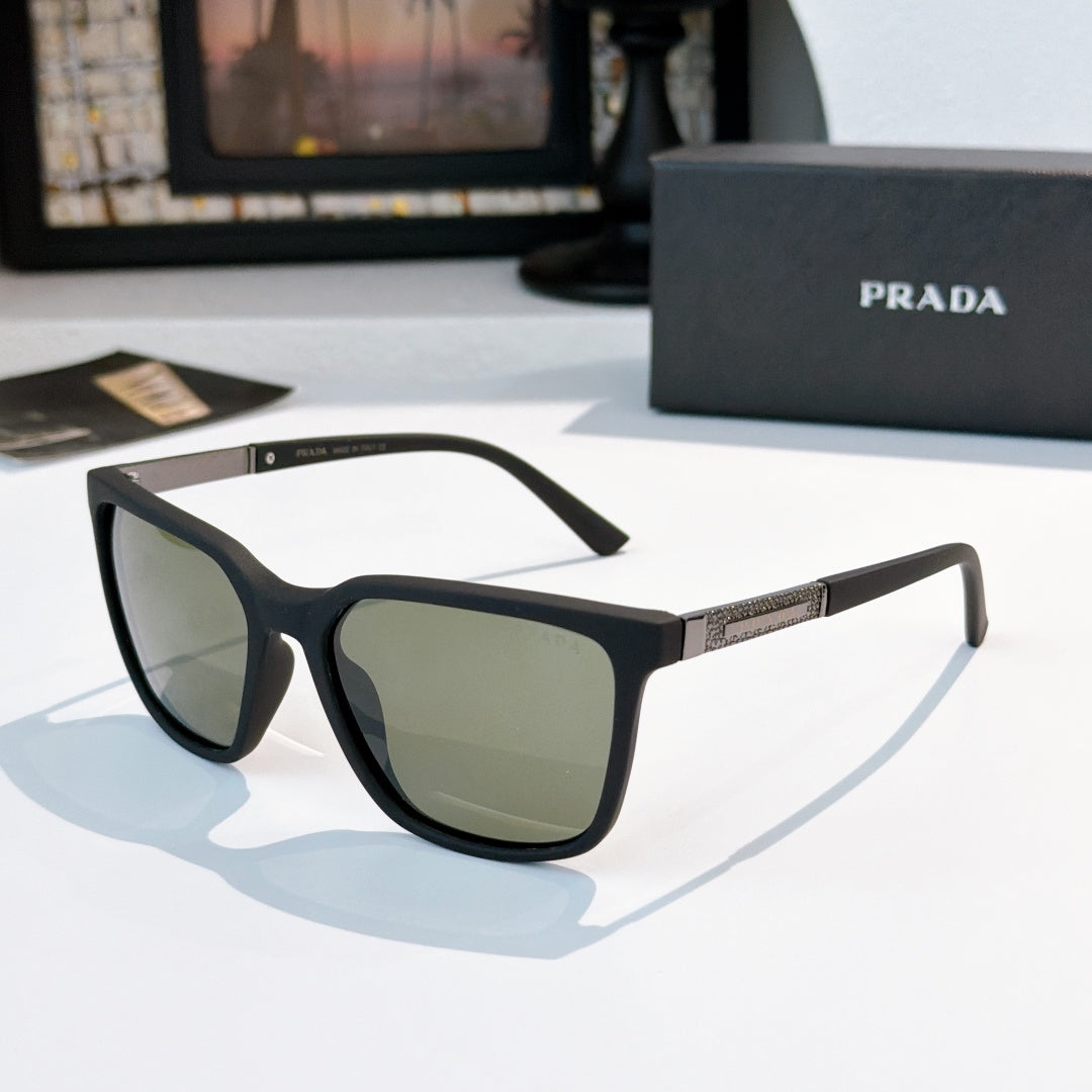 Prada sunglasses, dark frames with green-tinted lenses