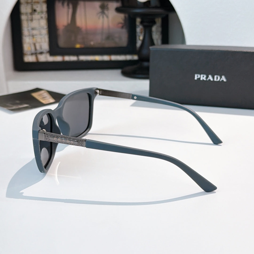 Prada sunglasses with muted blue arms and dark lenses