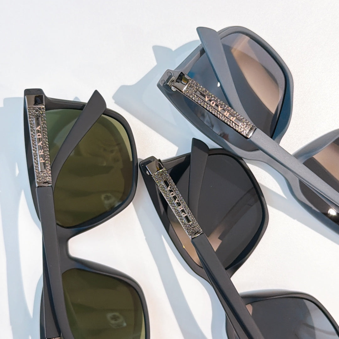Prada sunglasses set: dark, green, and smoky lenses with crystal-textured arms