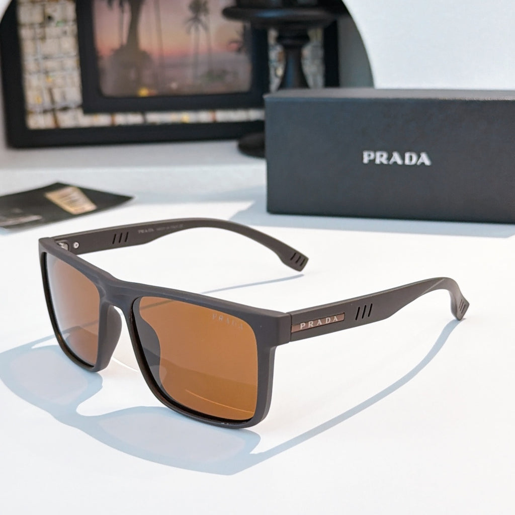 Rectangular sunglasses with dark frame and amber-brown lenses