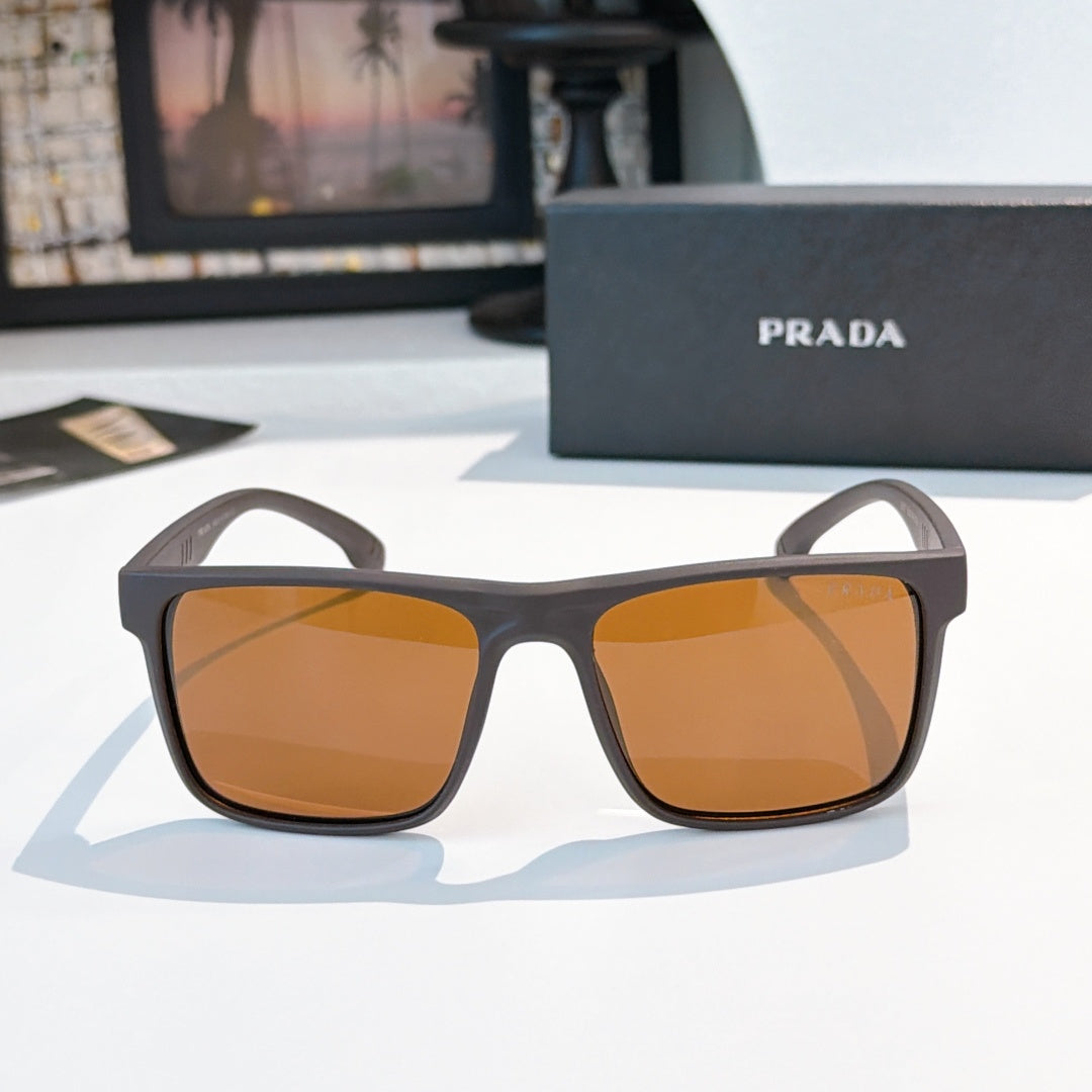 Square sunglasses with dark tortoiseshell frame and amber tinted lenses
