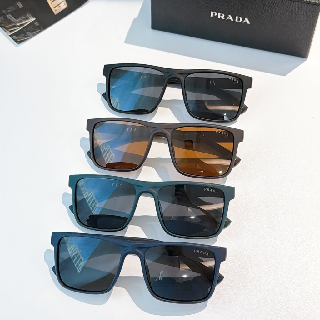 Multiple rectangular sunglasses with blue, brown, and black frames on display