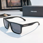 Rectangular sunglasses with black frame and dark gray-blue lenses