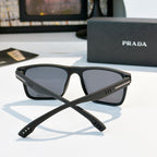 Rectangular sunglasses with black frame and dark tinted lenses, front view