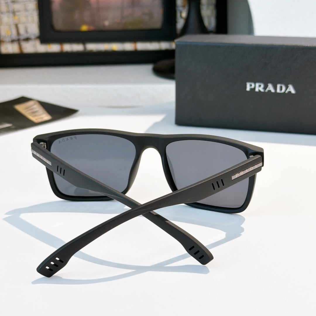 Rectangular sunglasses with black frame and dark tinted lenses, front view