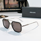 Prada sunglasses with brown lenses, black frames, and silver-tone metal arms