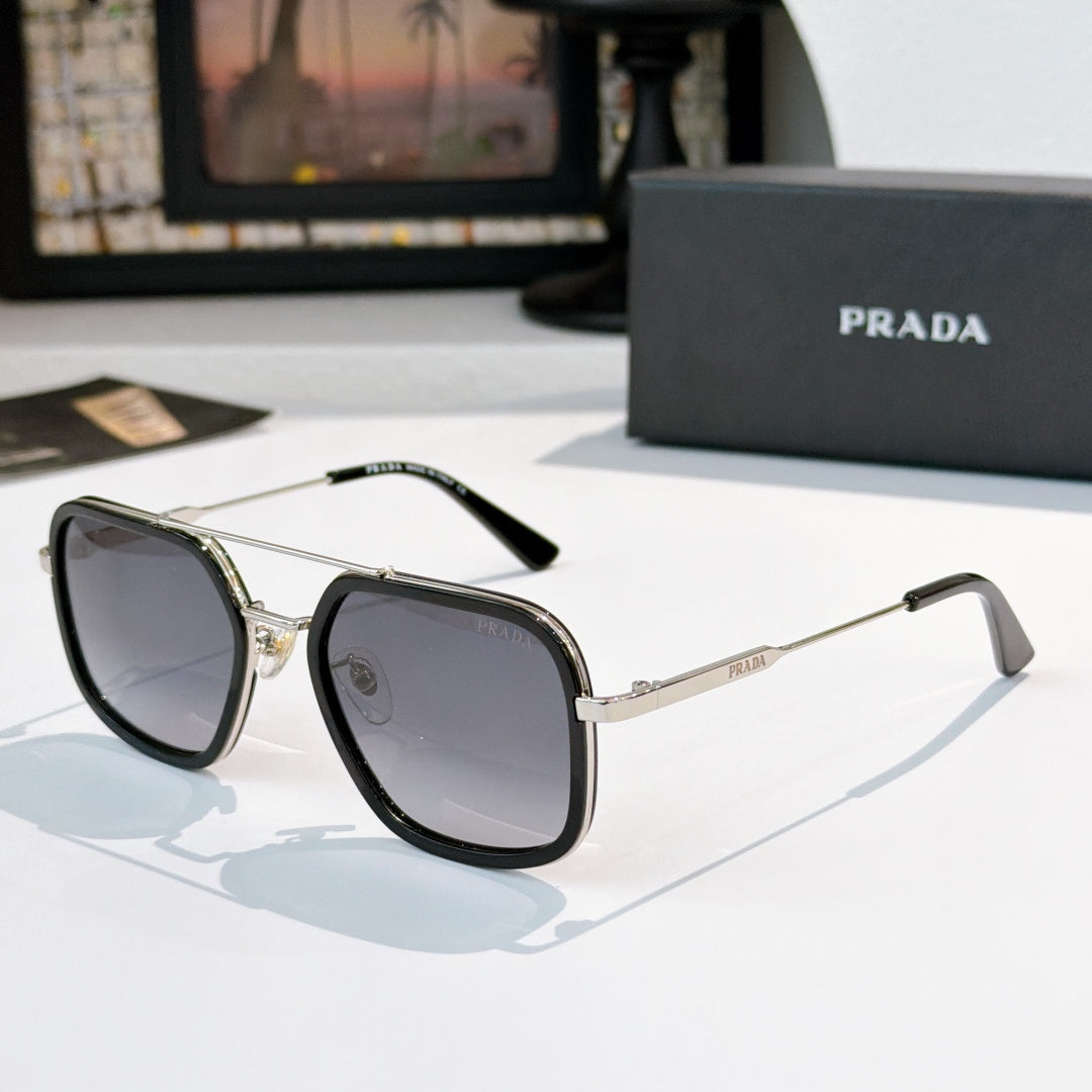 Prada sunglasses with gray lenses, black frames, and silver-tone metal arms