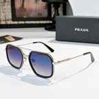 Prada sunglasses with blue lenses, black frames, and gold-tone metal arms