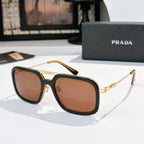 Prada sunglasses with amber frame and brown-tinted lenses