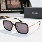 Prada sunglasses with dark frame and mauve-tinted lenses