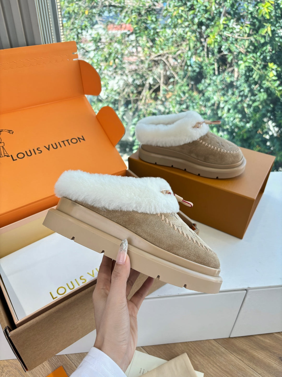 Louis Vuitton shearling loafers, tan suede upper with white fur collar and stitched edge