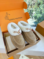 Louis Vuitton shearling loafers, tan suede with white fur lining and red trim