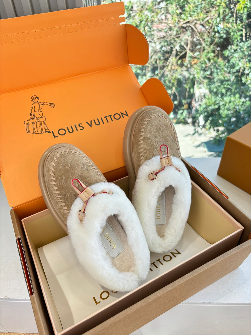 Louis Vuitton shearling loafers, tan suede with white fur collar and front strap