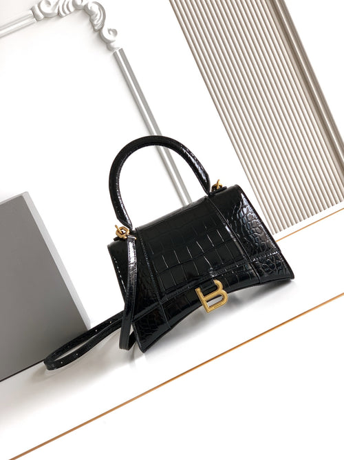 Balenciaga handbag in black croc-embossed leather with top handle and shoulder strap