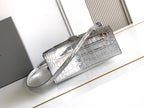 Silver croc-embossed top-handle bag with long shoulder strap and front clasp