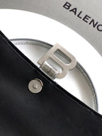 Gray lining with Balenciaga lettering and silver buckle on strap