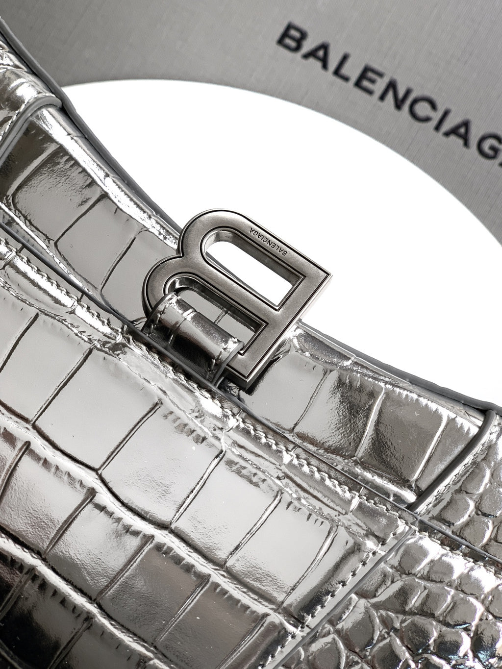 Silver croc-embossed bag with engraved front frame clasp and textured leather