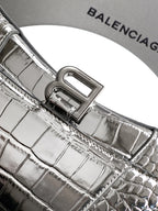 Silver croc-embossed bag with engraved front frame clasp and textured leather