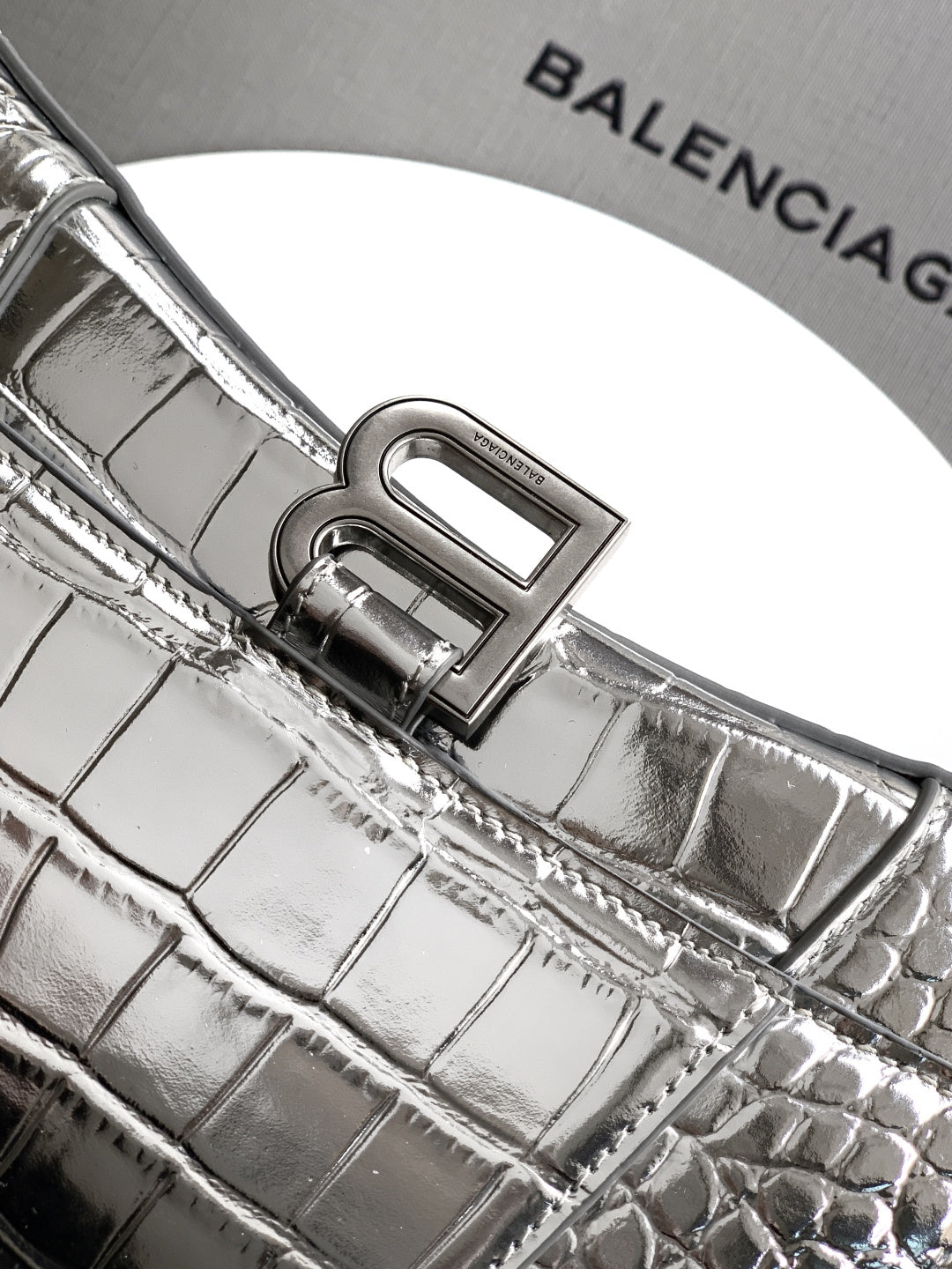 Silver croc-embossed bag with engraved front frame clasp and textured leather