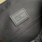 Louis Vuitton leather bag interior label with logo text and stitched border