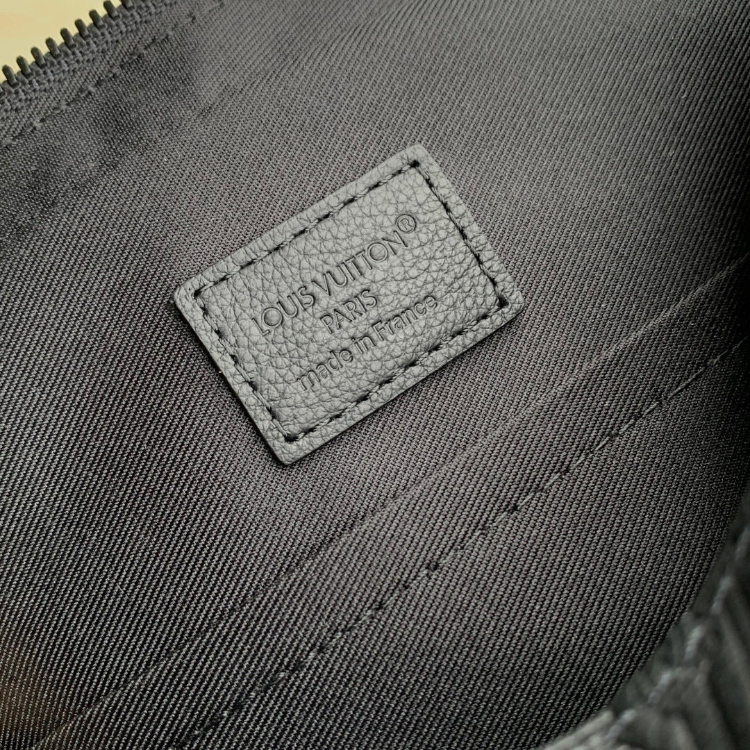 Louis Vuitton leather bag interior label with logo text and stitched border