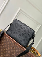 Louis Vuitton monogram crossbody bag with front zipper and black shoulder strap