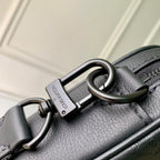 Louis Vuitton leather crossbody bag with metal carabiner ring and zipper hardware