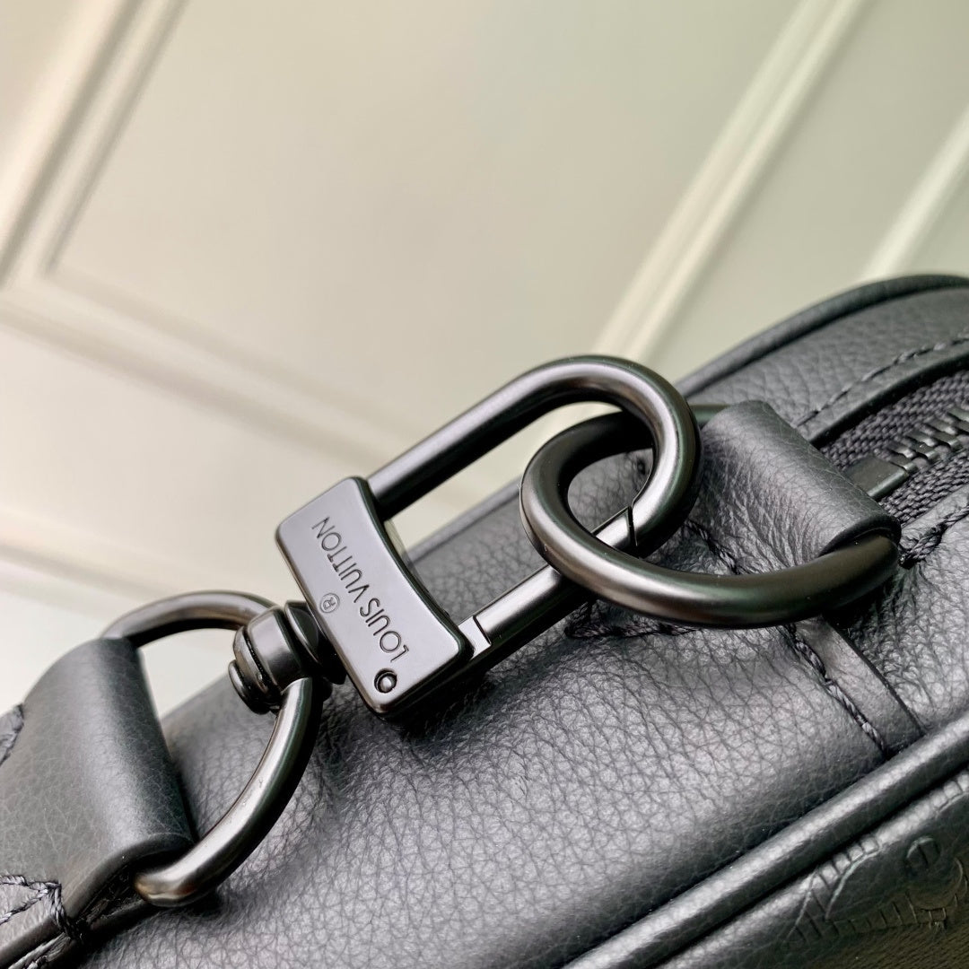 Louis Vuitton leather crossbody bag with metal carabiner ring and zipper hardware