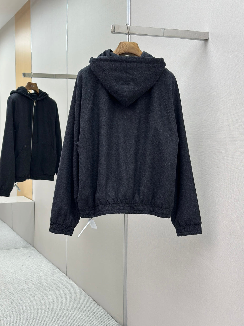 Fendi dark blue zip-up hoodie jacket, back view with hood and ribbed cuffs