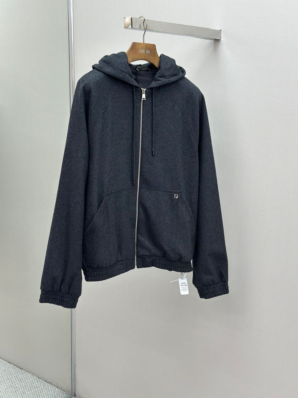 Fendi dark blue zip-up hoodie jacket on hanger with drawstring hood and zip front