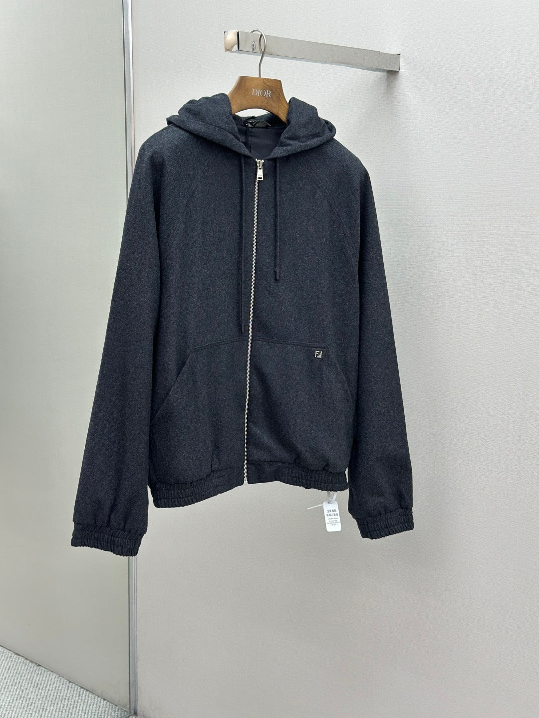 Fendi dark blue zip-up hoodie jacket on hanger with drawstring hood and zip front