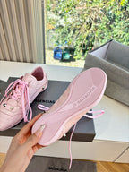 Women's pink sneakers sole view with ribbed outsole and BALENCIAGA text