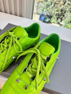 Balenciaga lime green lace-up sneakers close-up of laces, eyelets, and stitched panels