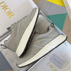 Dior unisex sneakers in light gray, side view with lace-up closure and chunky midsole
