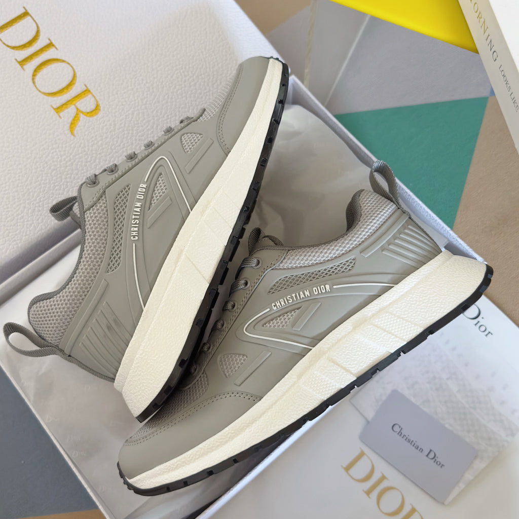 Pair of light gray lace-up sneakers with contrast dark outsole and thick cushioned midsole