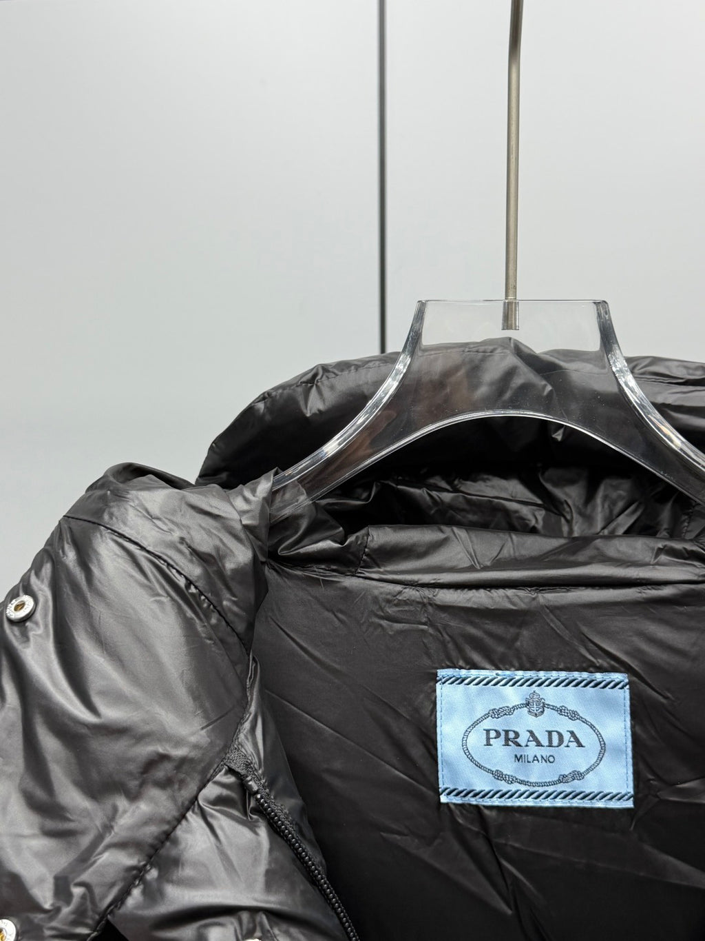 Prada black long puffer jacket inside neck label with Prada Milano tag