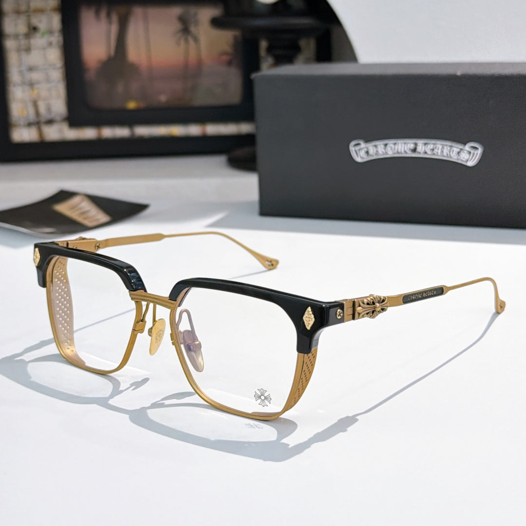 Black and gold rectangular eyeglasses with clear lenses and decorative temple accents.
