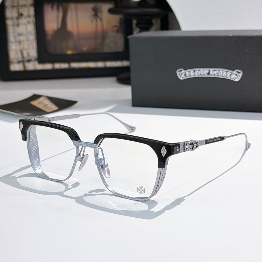 Black and silver eyeglasses with clear lenses, rectangular frame and patterned temple bars.