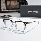 Black and silver eyeglasses with clear lenses, rectangular frame and patterned temple bars.