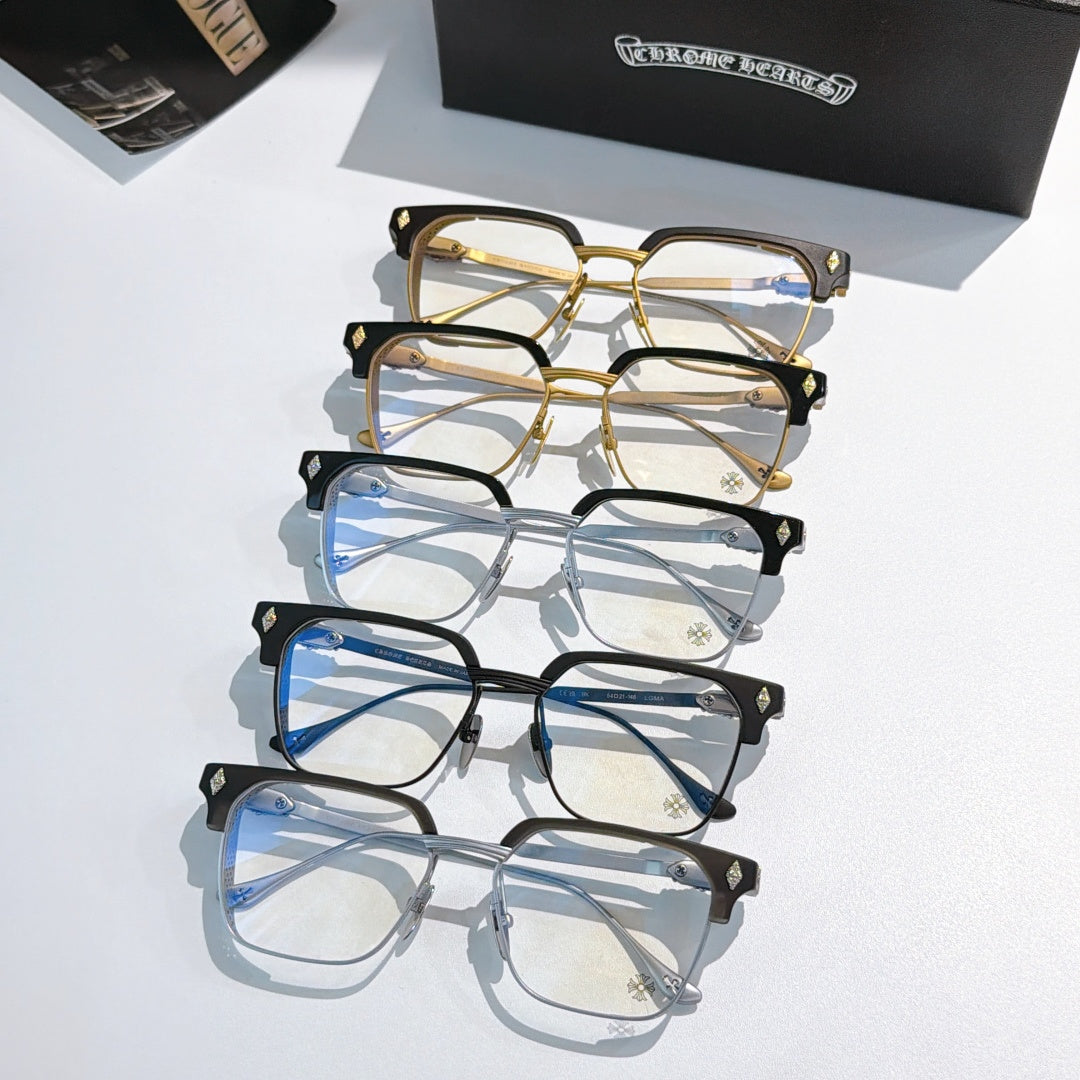 Stack of eyeglasses with gold, black, and silver frames and clear rectangular lenses.