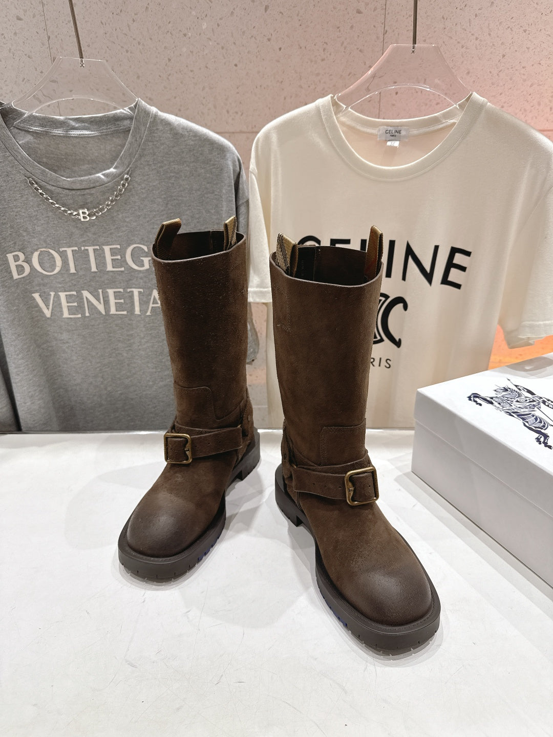 Burberry brown suede buckle tall boots, angled front view with side straps