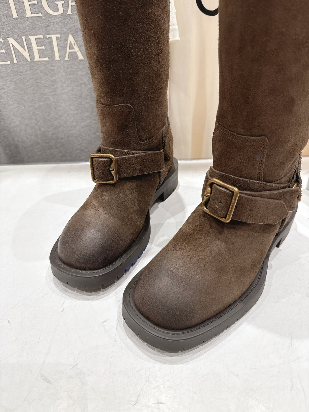 Burberry brown suede buckle tall boots, close-up of side strap buckle and sole