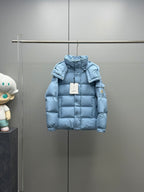 Light blue quilted puffer jacket with hood and front zipper, front view