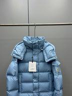 Light blue quilted puffer jacket with hood and front zipper, back collar view