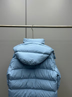 Light blue quilted puffer jacket with hood, back view and horizontal baffles
