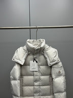 White long puffer jacket with hood, quilted front, and sleeve logo patch