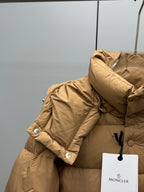 Moncler long puffer jacket in tan with ribbed cuffs and snap buttons